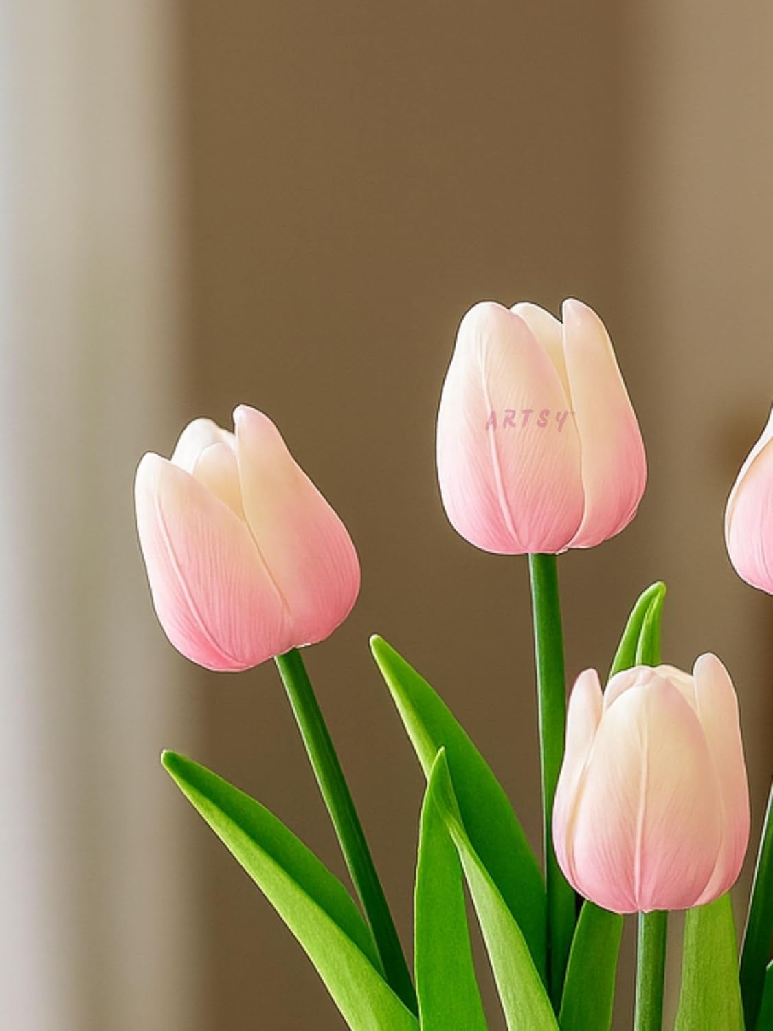 Baby pink tulips with green stems on a blurred brown background