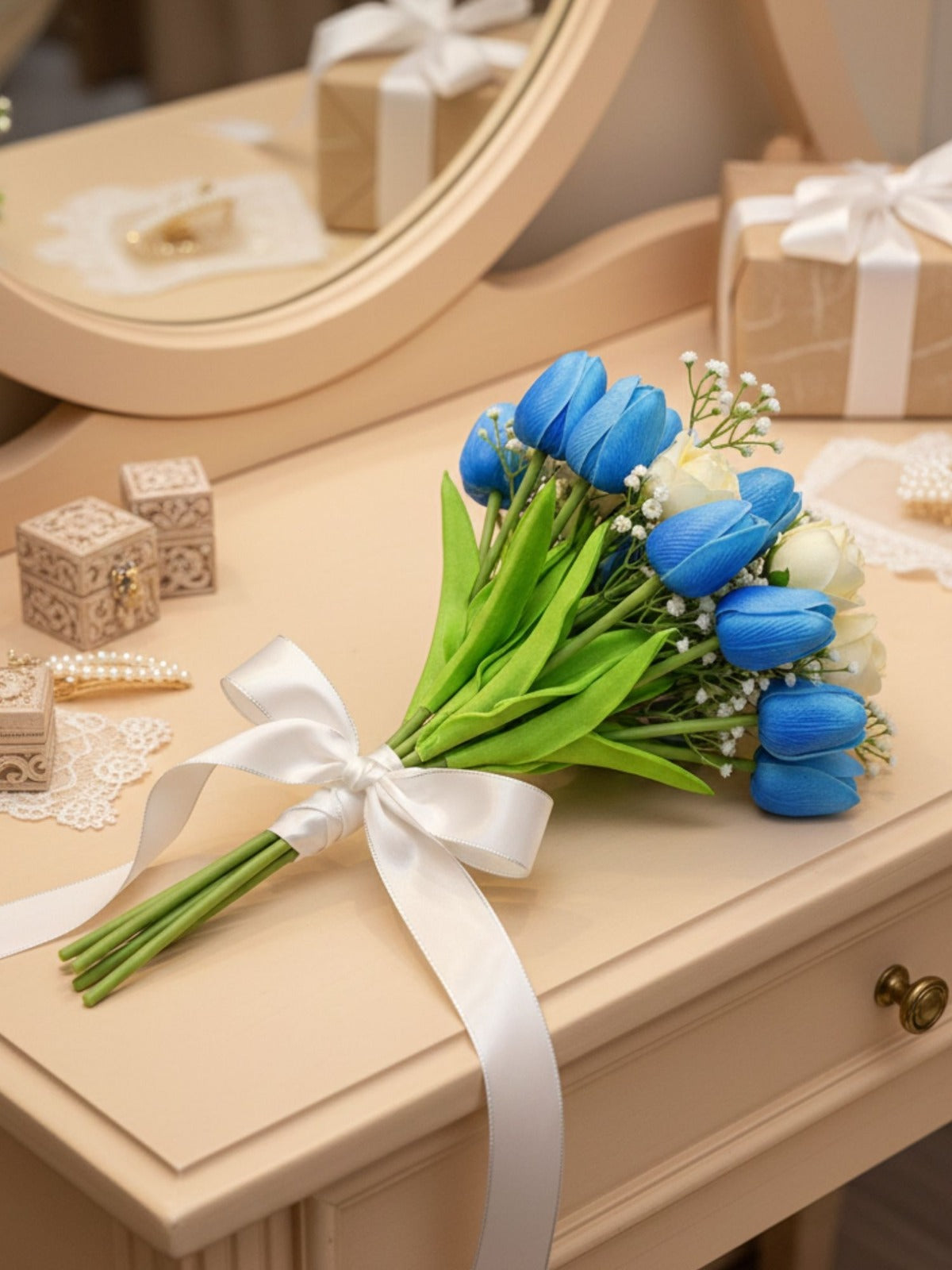 Bouquet of blue tulips with a white ribbon on a wooden surface