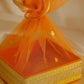 Close-Up of Orange Net Gift Hamper Box with Golden Border Detailing