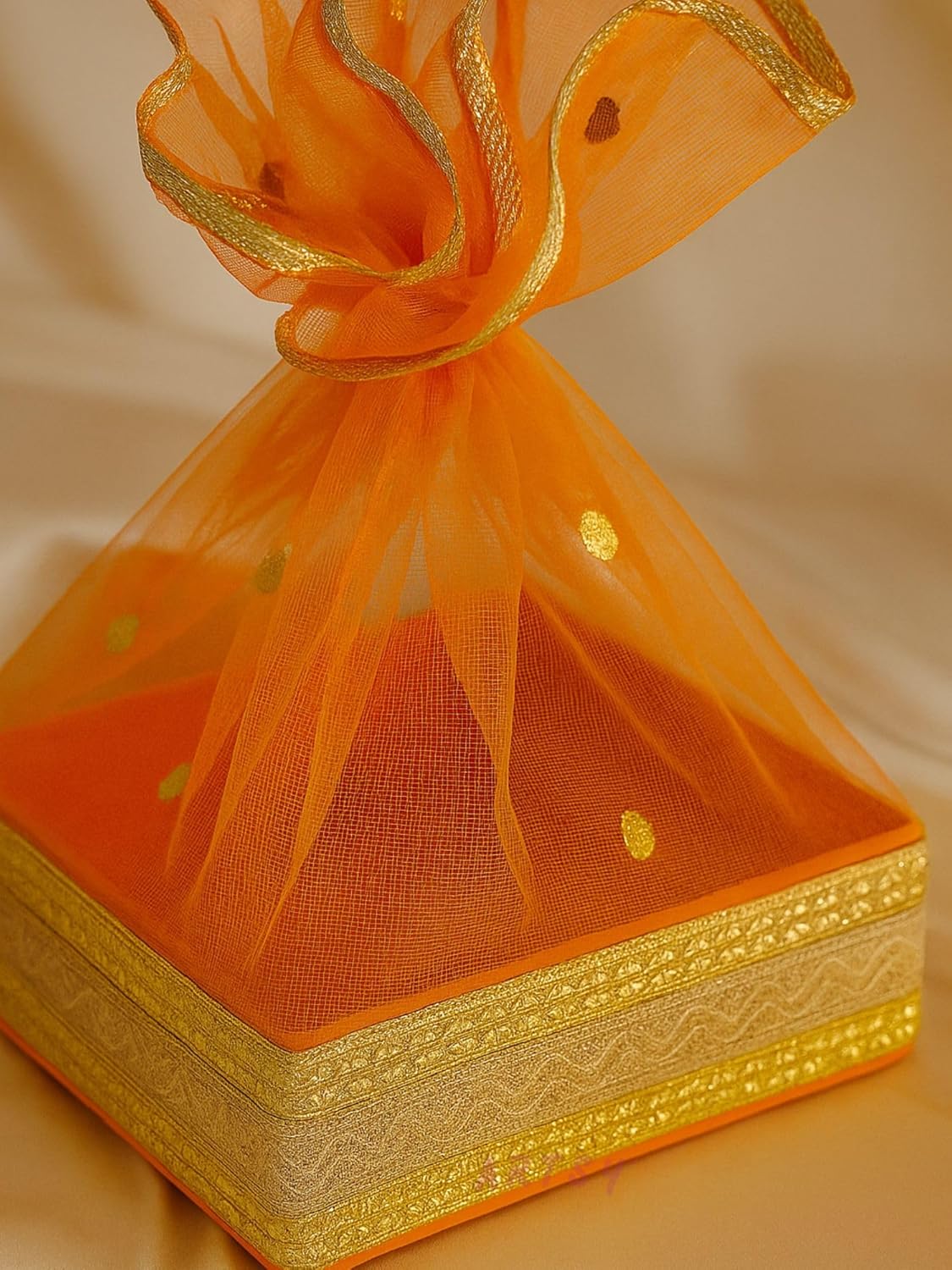 Close-Up of Orange Net Gift Hamper Box with Golden Border Detailing