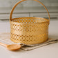 Decorative gold basket with intricate patterns 