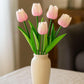 Vase with baby pink tulips on a neutral background