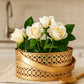 White roses in a gold decorative pot