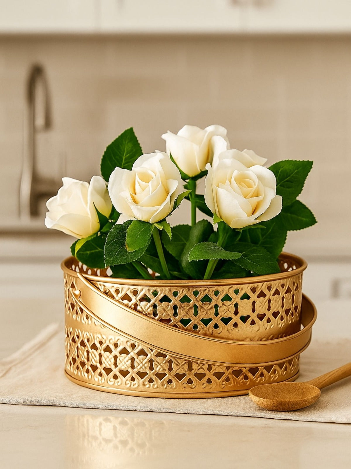 White roses in a gold decorative pot