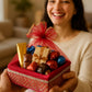maroon festive gift basket with chocolates and decorative net cover
