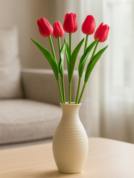 red artificial tulips in vase